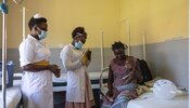 Health workers in the Nutrition Department of Soroti Regional Referral Hospital in Uganda check on a mother and her child.