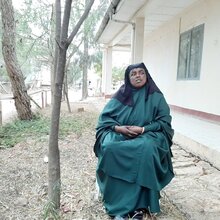 Photo of Weyzero Ayane Hassen sitting outside a health facility
