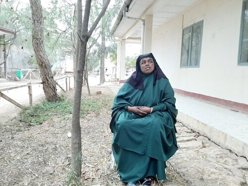 Photo of Weyzero Ayane Hassen sitting outside a health facility