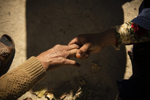 Photo of two hands grasping each other