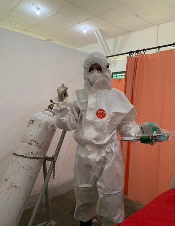 A health worker in a hazmat suit
