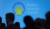 World Health Summit 2022 Logo. Blue background with people's silhouette in the foreground.