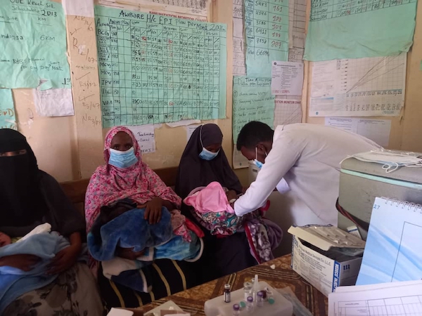 Three women and one health care provider in a waiting room